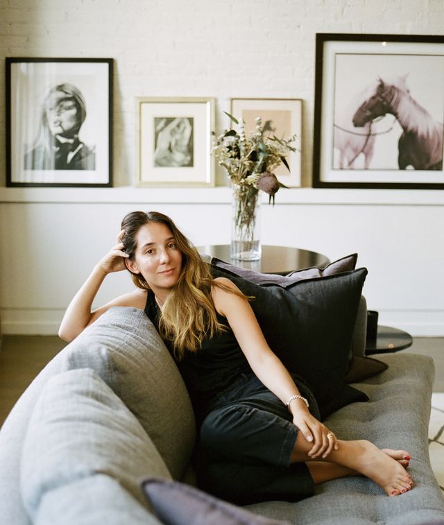 casa blanca ceo and founder hannah bomze sitting on a couch