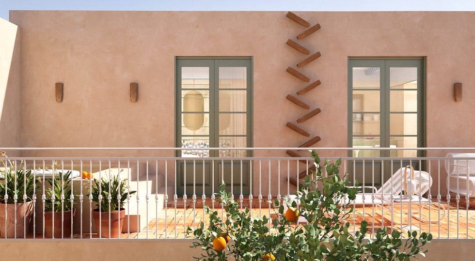el estudio cateto cateto diseñauna original casa pequeña con distribución abierta en sevilla que comparte el espacio del dormitorio en suite con el salóncomedor y la cocina