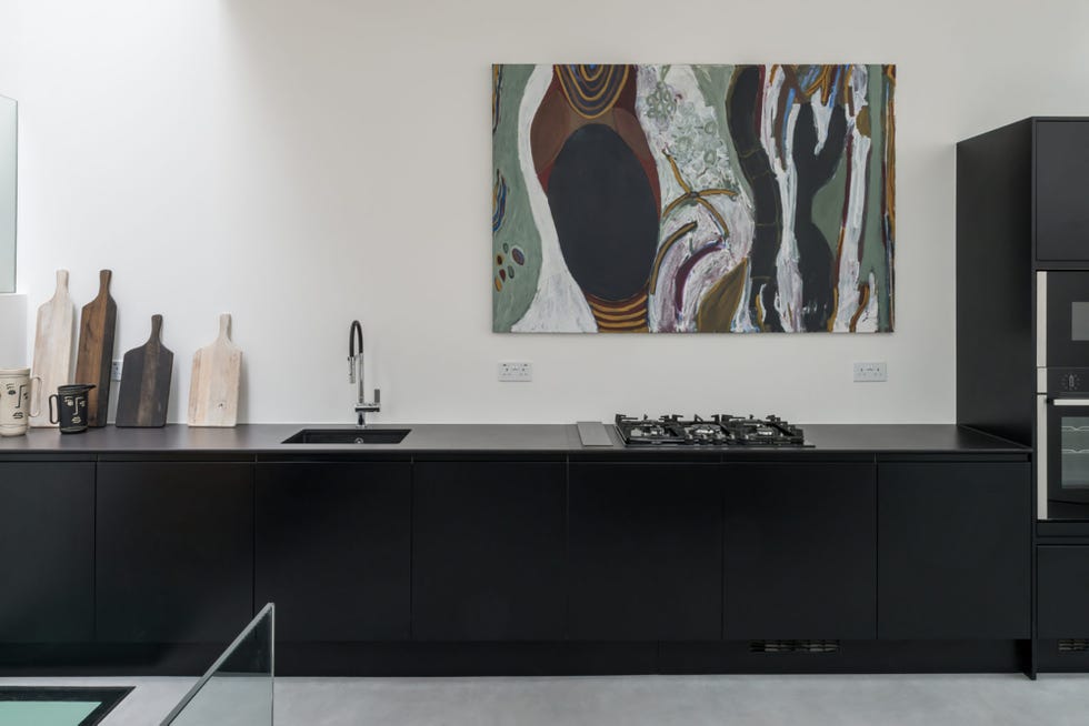 cocina moderna con muebles lacados en color negro sin tiradores
