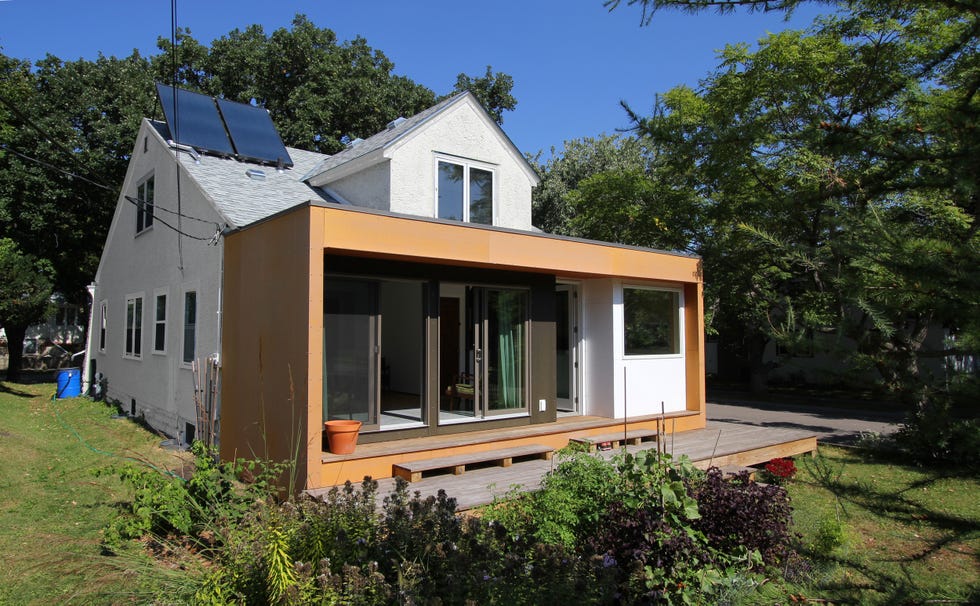 casa con pabellón de construcción sostenible con acceso al jardín