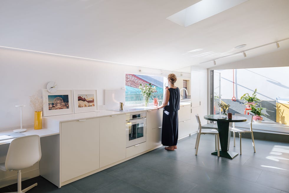 casa gialla gon architects, una reforma integral de ático con terraza