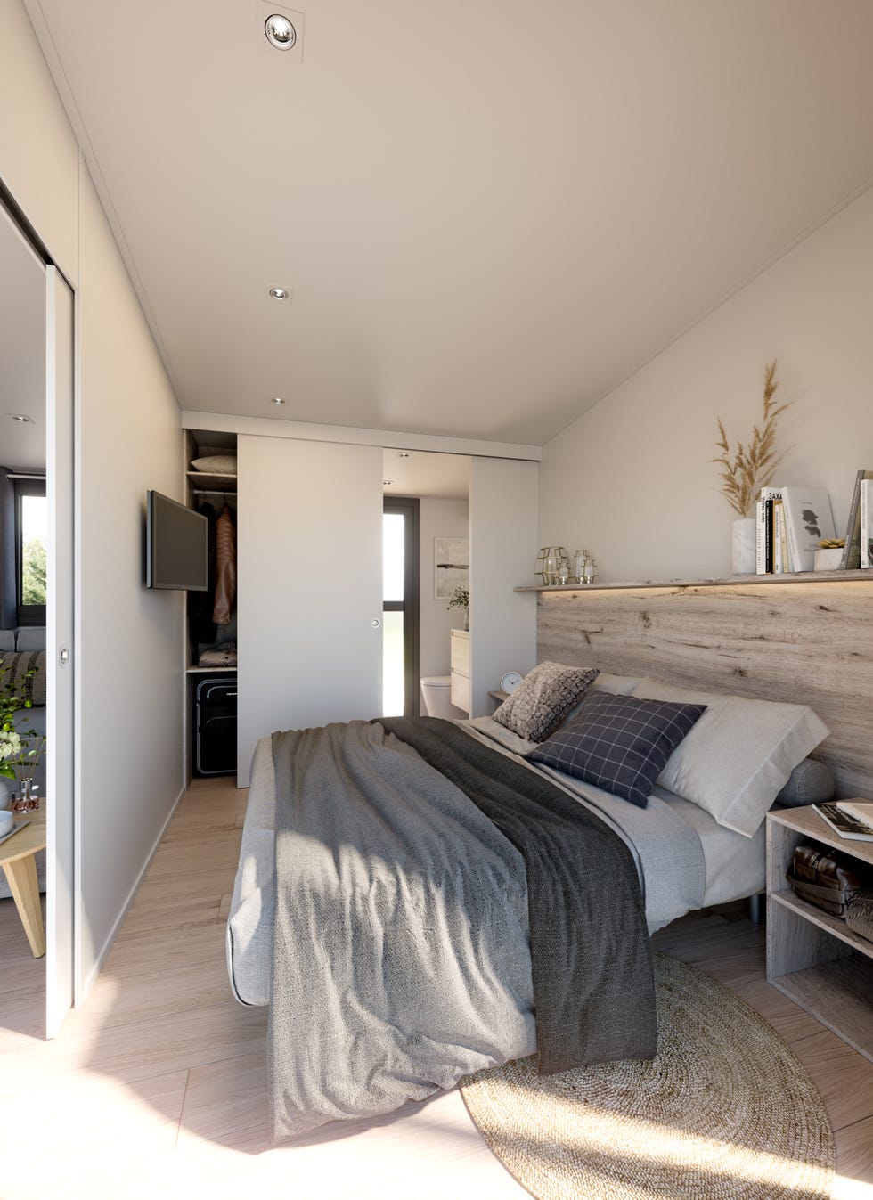 Dormitorio principal con cabecero de madera y tonos neutros