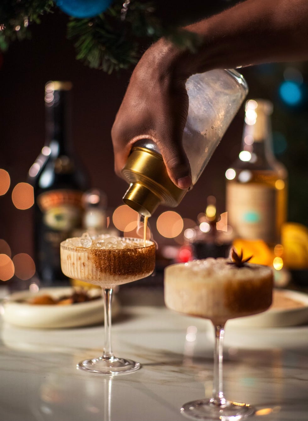 cocktail preparation scene with drinks on a table