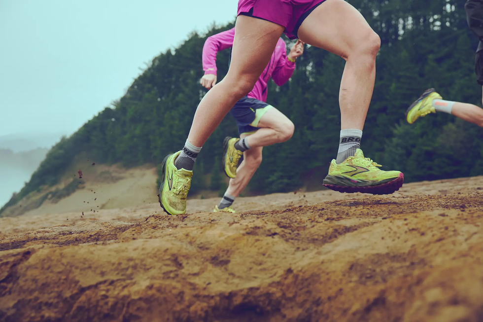 runners in a natural setting showcasing dynamic movement and athletic footwear
