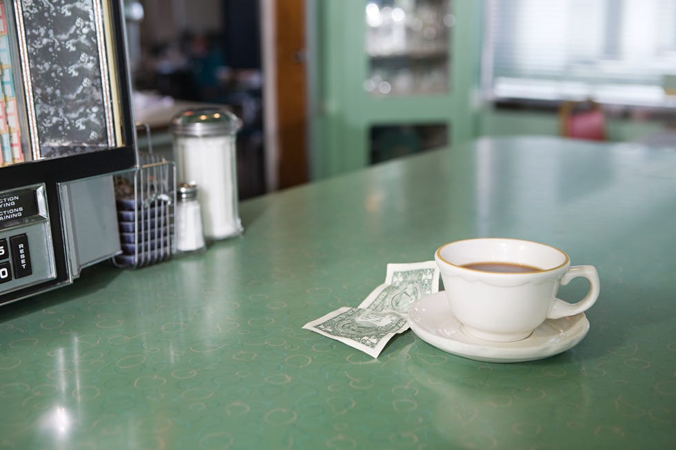 Cup, Coffee cup, Cup, Table, Saucer, Serveware, Floor, Flooring, Drinkware, Material property, 
