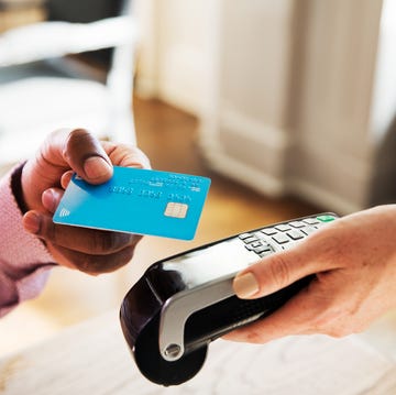 Man using contactless payment, close up women tapping contactless instead of using cash