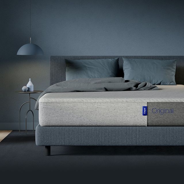 casper mattress on bed in a dark grayblue room