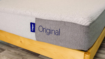 a close up photo of a gray casper original mattress