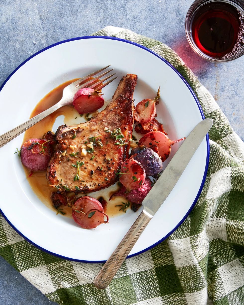 pork chops with roasted maplebacon radishes on a dinner plate