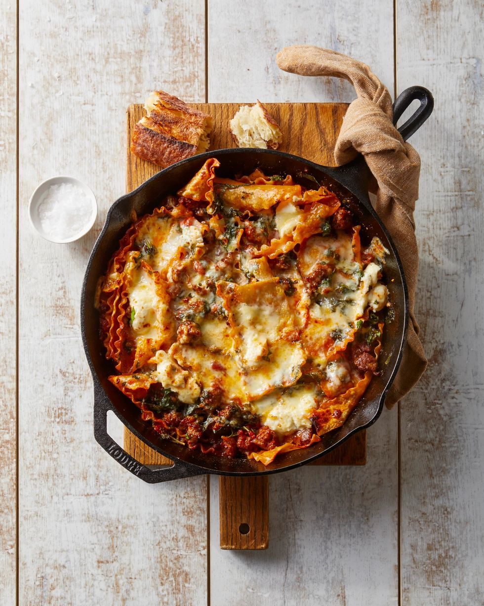 sausage and cheese lasagna in a cast iron skillet
