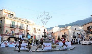 a group of people running on a street