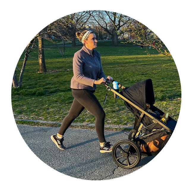 person jogging with a stroller in a park setting