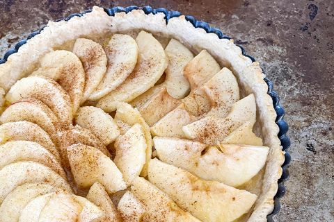 a beautiful pie with perfectly peeled and sliced fruit