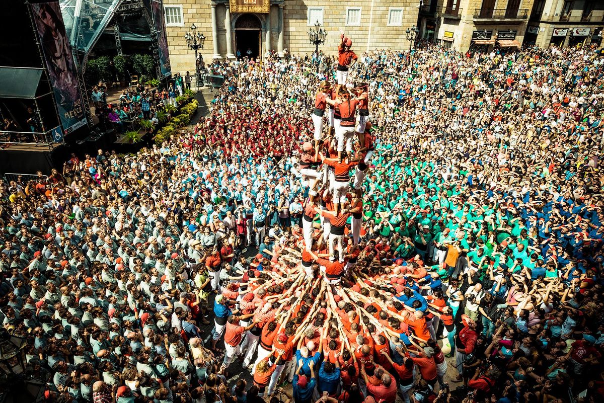 The castellers of Barcelona build a human tower in front of Barcelonas town hall during the city annual festival La Merc