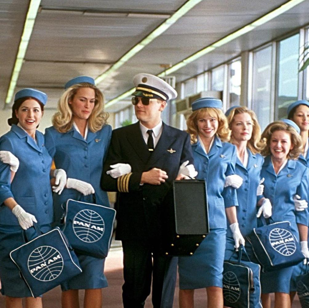Uniform, Bag, Wall clock, Luggage and bags, Electric blue, Clock, Team, White-collar worker, Employment, Sun hat, 