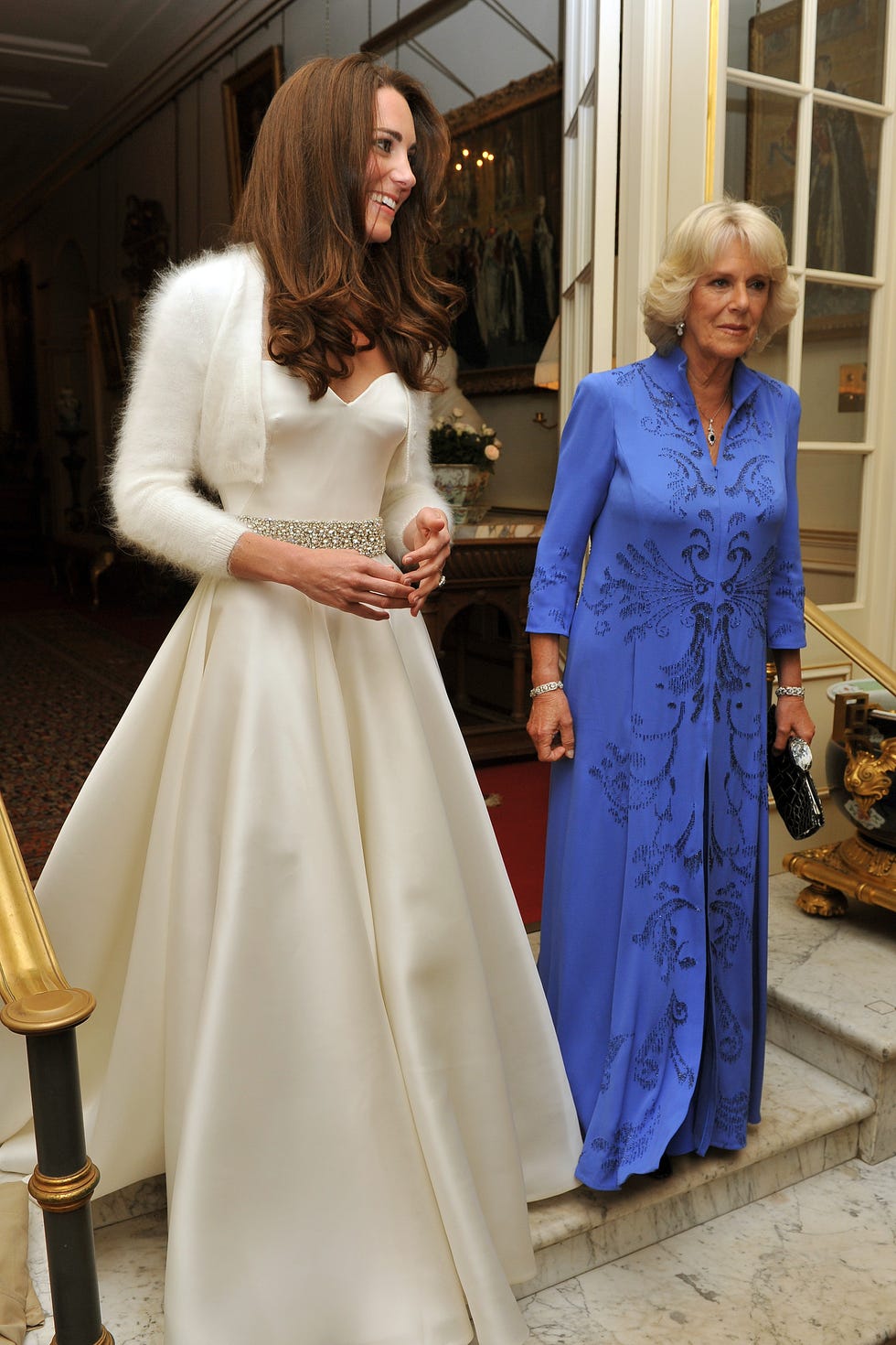 london, united kingdom   april 29  catherine, duchess of cambridge l and camilla, duchess of cornwall leave clarence house to travel to buckingham palace for the evening celebrations following her wedding to prince william, duke of cambridge on april 29, 2011 in london, england the marriage of the second in line to the british throne was led by the archbishop of canterbury and was attended by 1900 guests, including foreign royal family members and heads of state thousands of well wishers from around the world have also flocked to london to witness the spectacle and pageantry of the royal wedding  photo by john stillwell   wpa poolgetty images