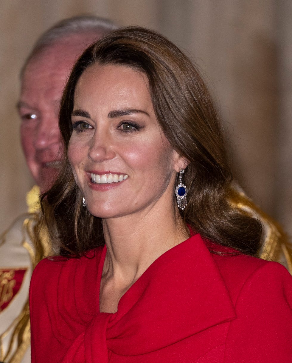 The Duchess of Cambridge looks festive in red at Christmas carol concert