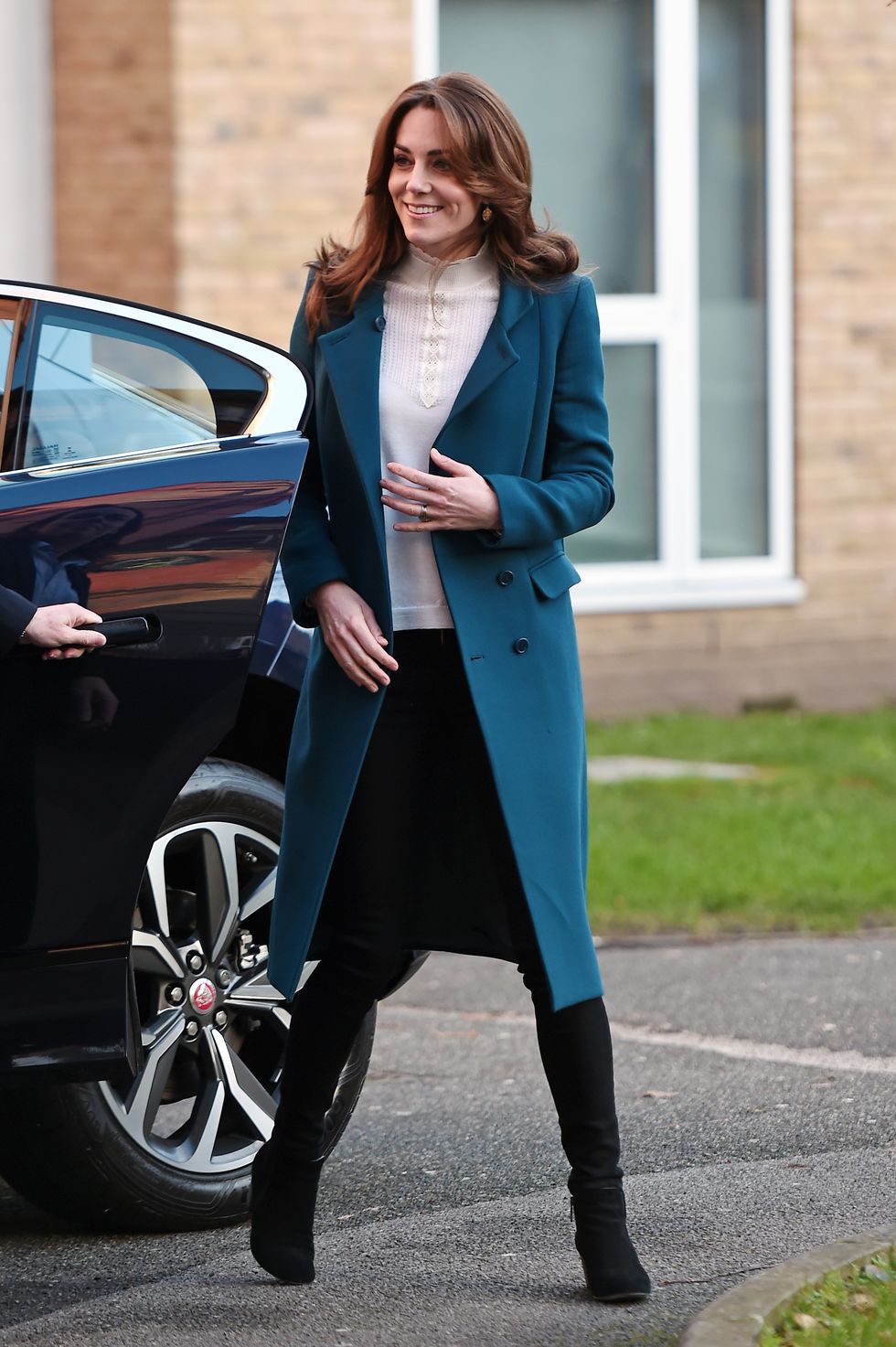 Kate Middleton Wore a Teal Coat and Skinny Black Jeans for Nursery Visit