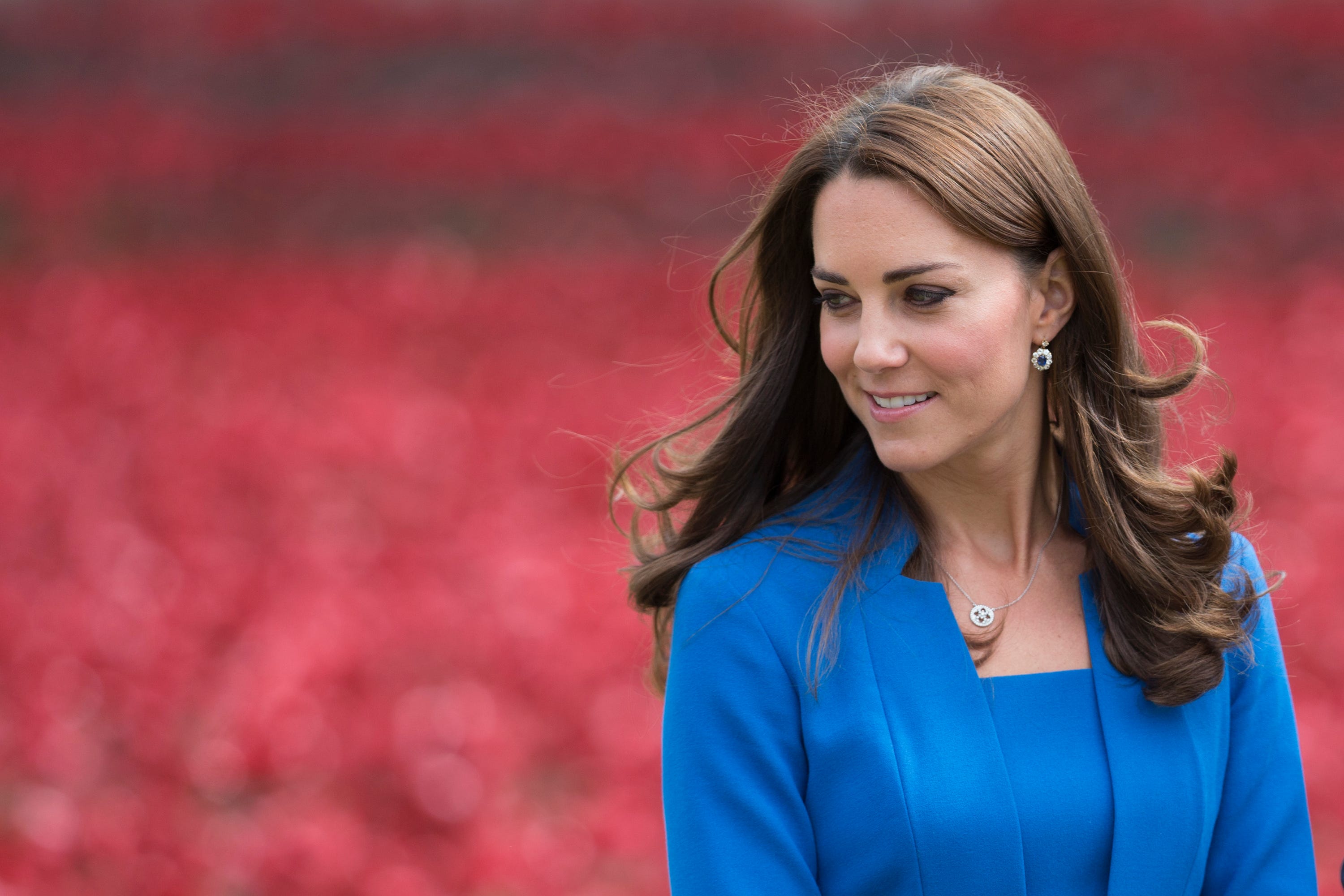 The Duke and Duchess of Cambridge and Prince Harry visit the field of ceramic poppies of the Tower of London