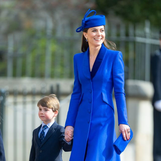A guest is seen wearing an orange and blue coat and a Louis