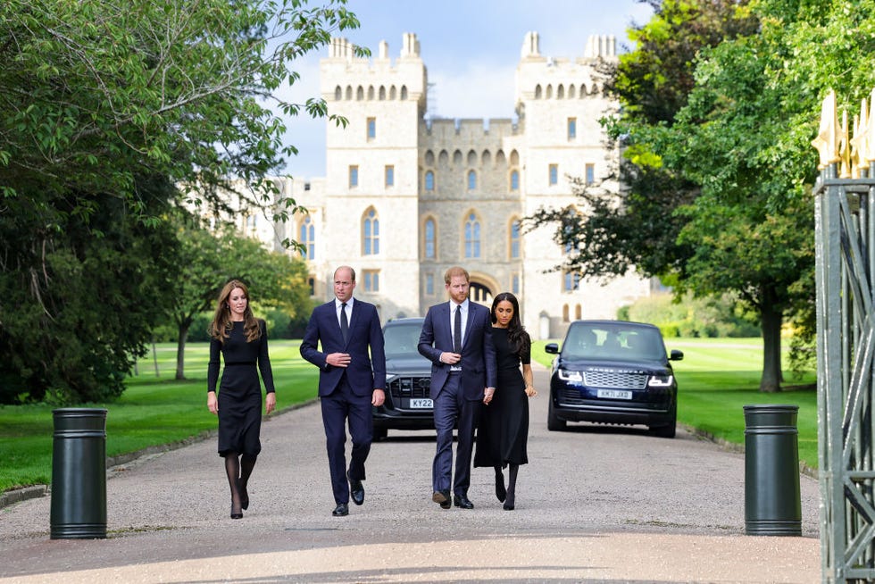 the prince and princess of wales accompanied by the duke and duchess of sussex greet wellwishers outside windsor castle