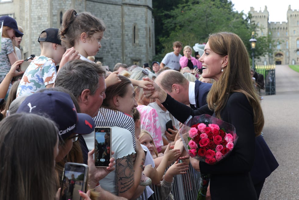the prince and princess of wales accompanied by the duke and duchess of sussex greet wellwishers outside windsor castle