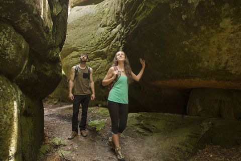 couple exploring cave