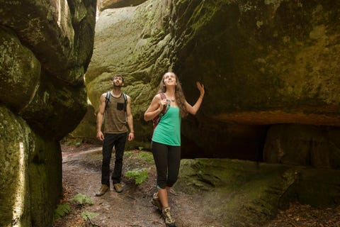 couple exploring cave