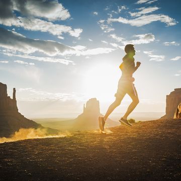 Caucasian man cortez running in Monument Valley, Utah, United States