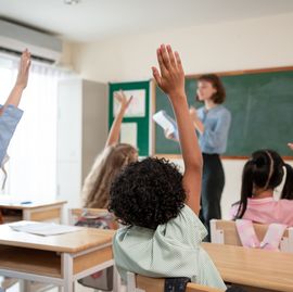 caucasian young woman teacher teaching student in classroom at school. attractive beautiful female instructor master explain and educate children with fun activity at preschool nursery kindergarten.