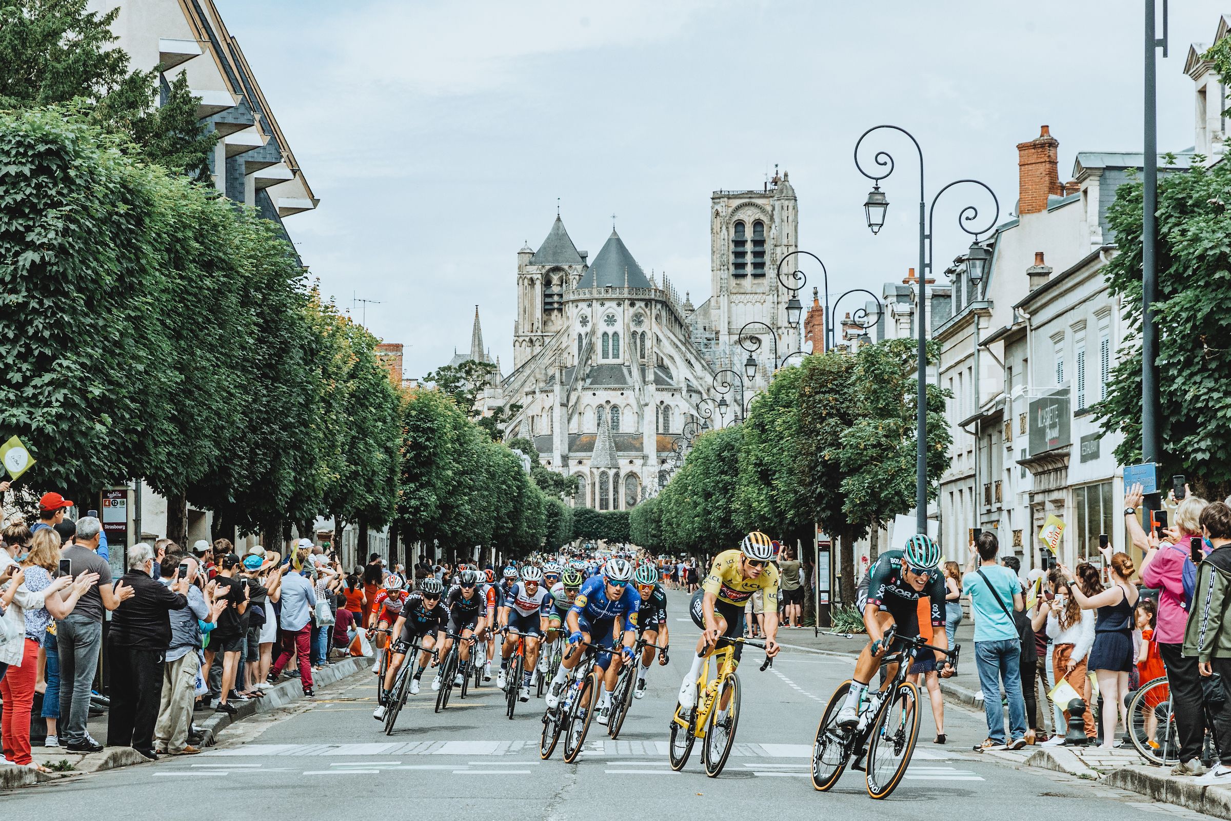 The peloton races through Bourges during Stage 7.