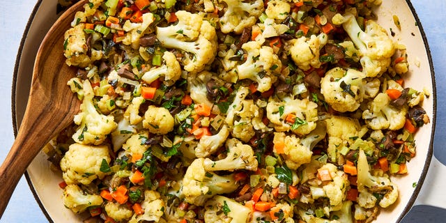 roasted cauliflower with veggies in a dish