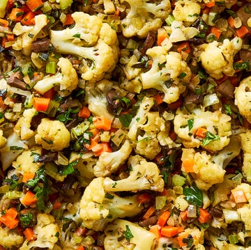 Cauliflower Stuffing roasted cauliflower with veggies in a dish
