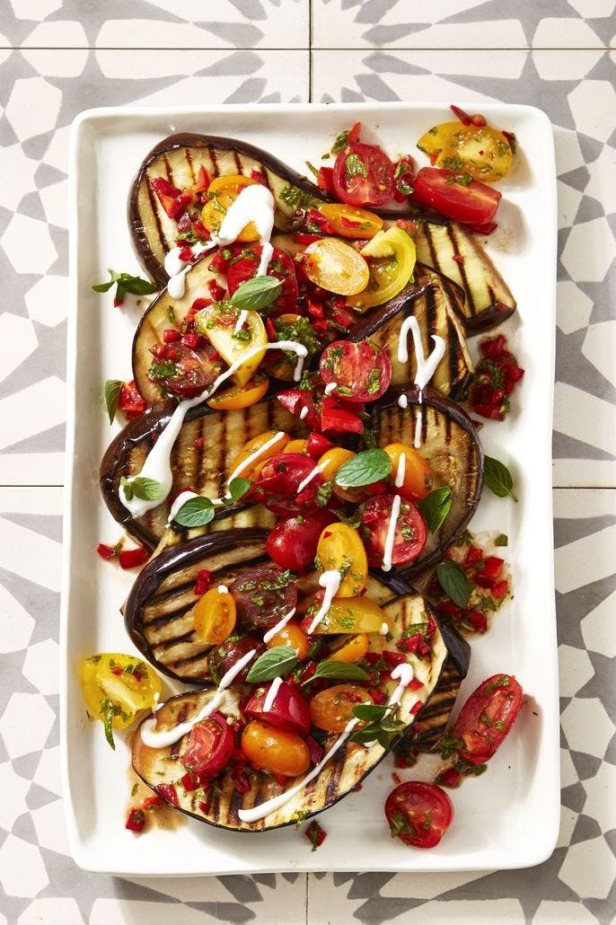 cayenne grilled eggplant tomato salad on a white plate