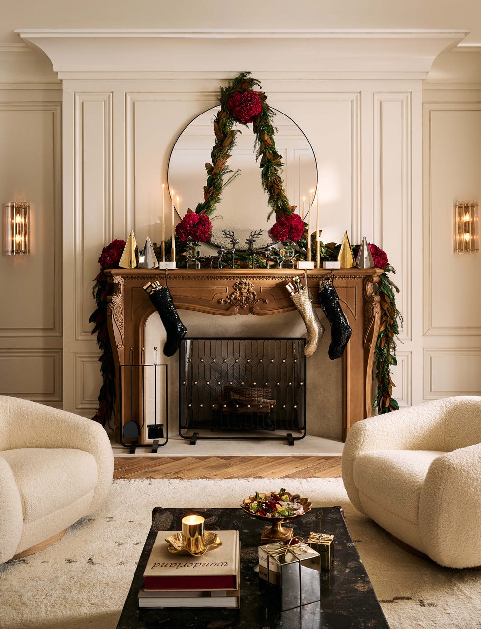 festively decorated fireplace mantel with stockings and holiday decor