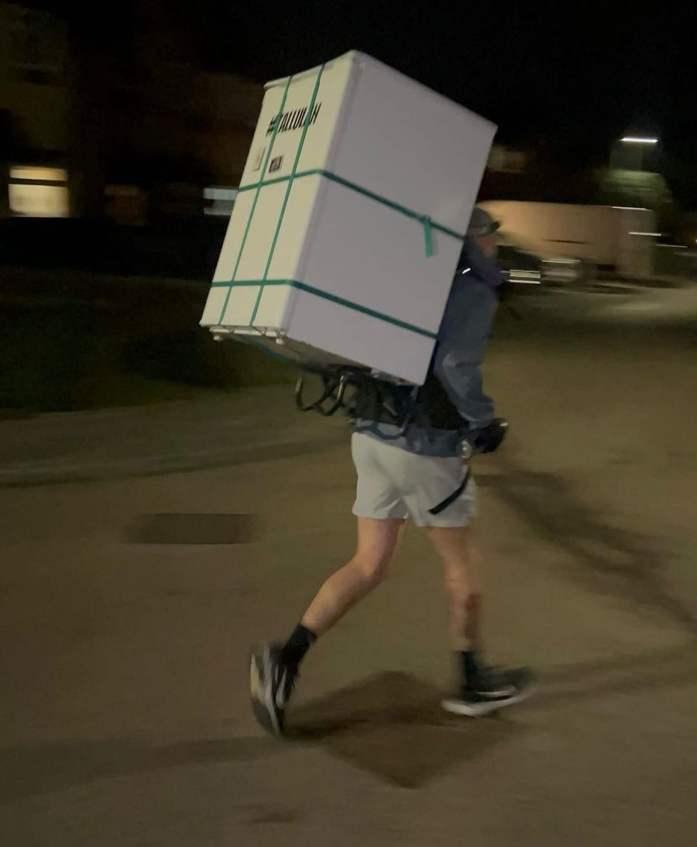 a person carrying a box