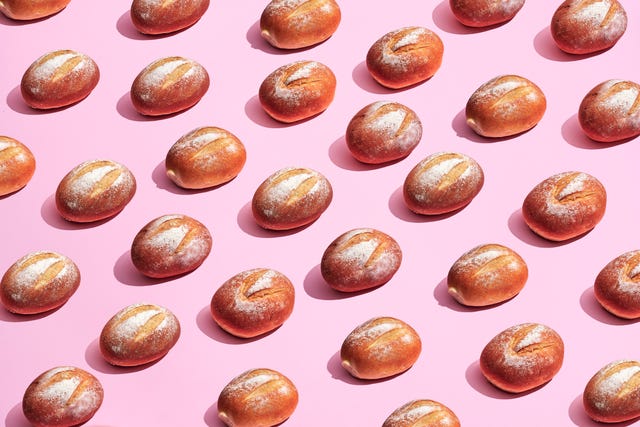 sourdough bread loaves on pink background