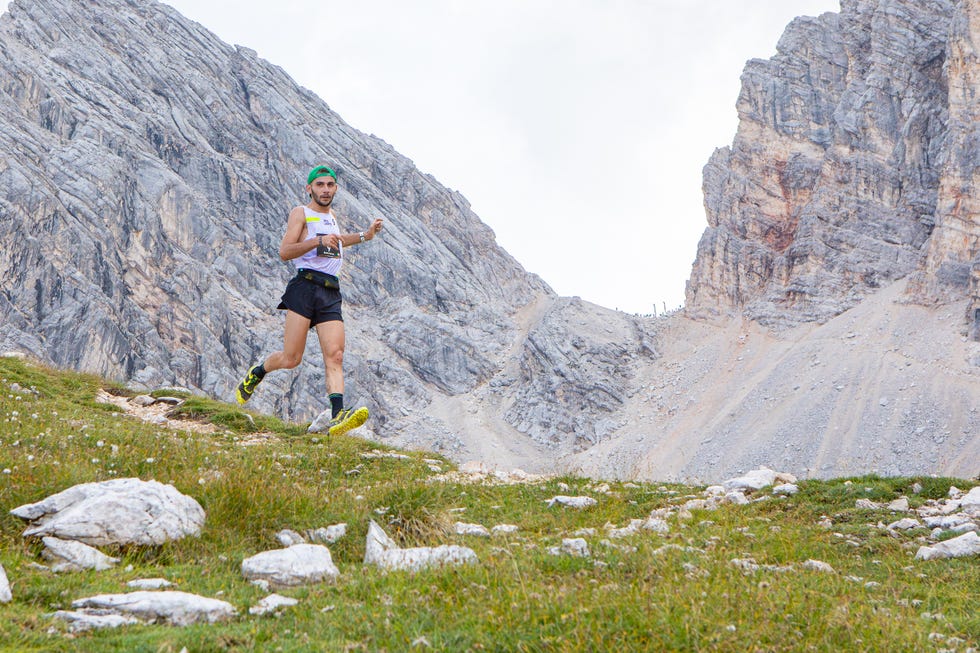 Runner navigating a mountainous terrain