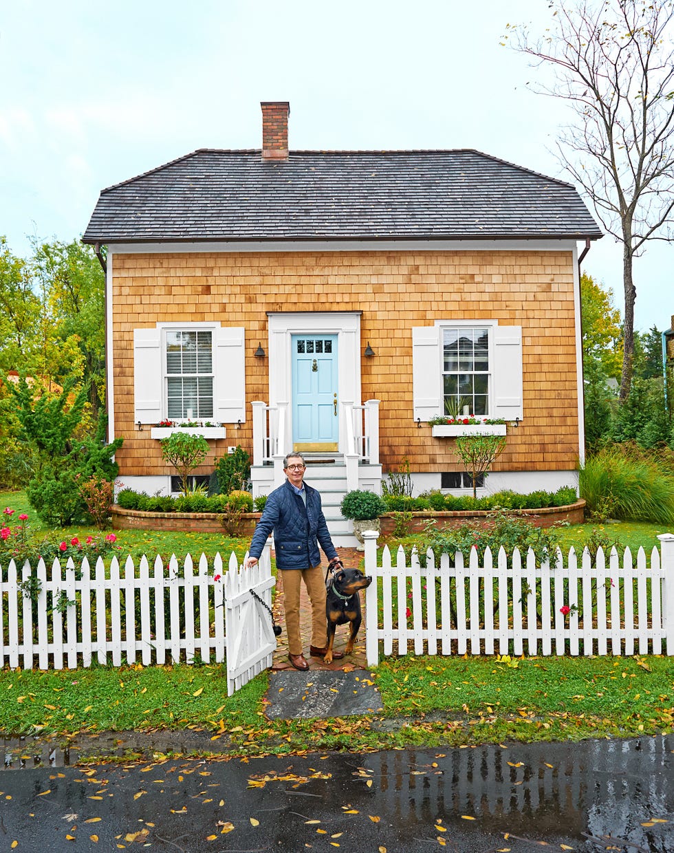 cedar shake cottage with light blue front door