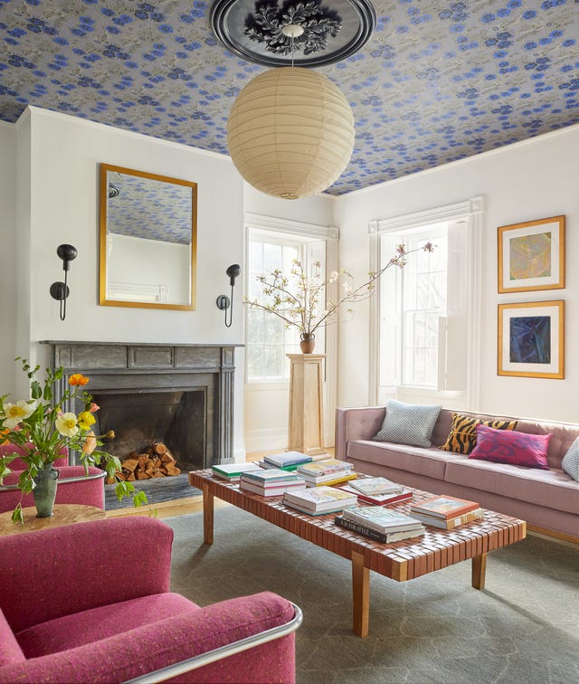 modern living room with a stylish design featuring a coffee table and colorful seating