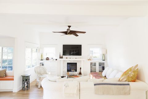 Ceiling fan over white living room
