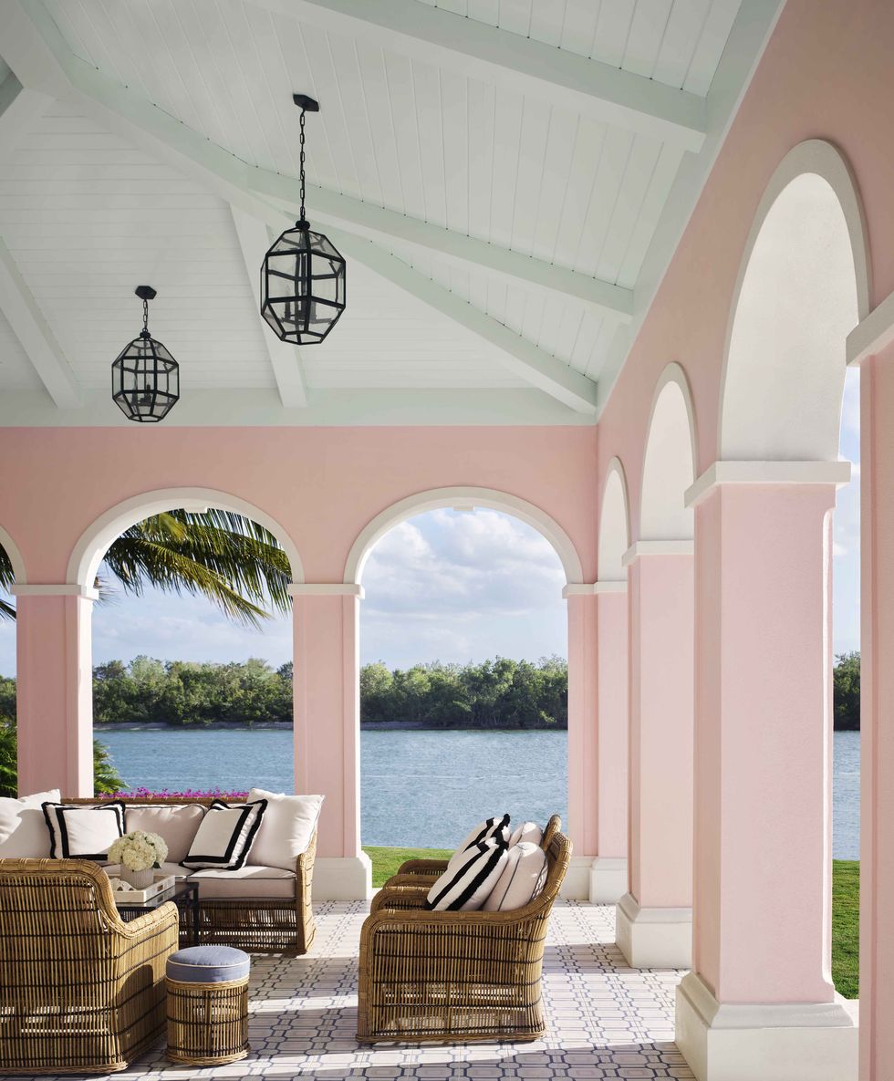pink stucco terrace on the water in naples, florida