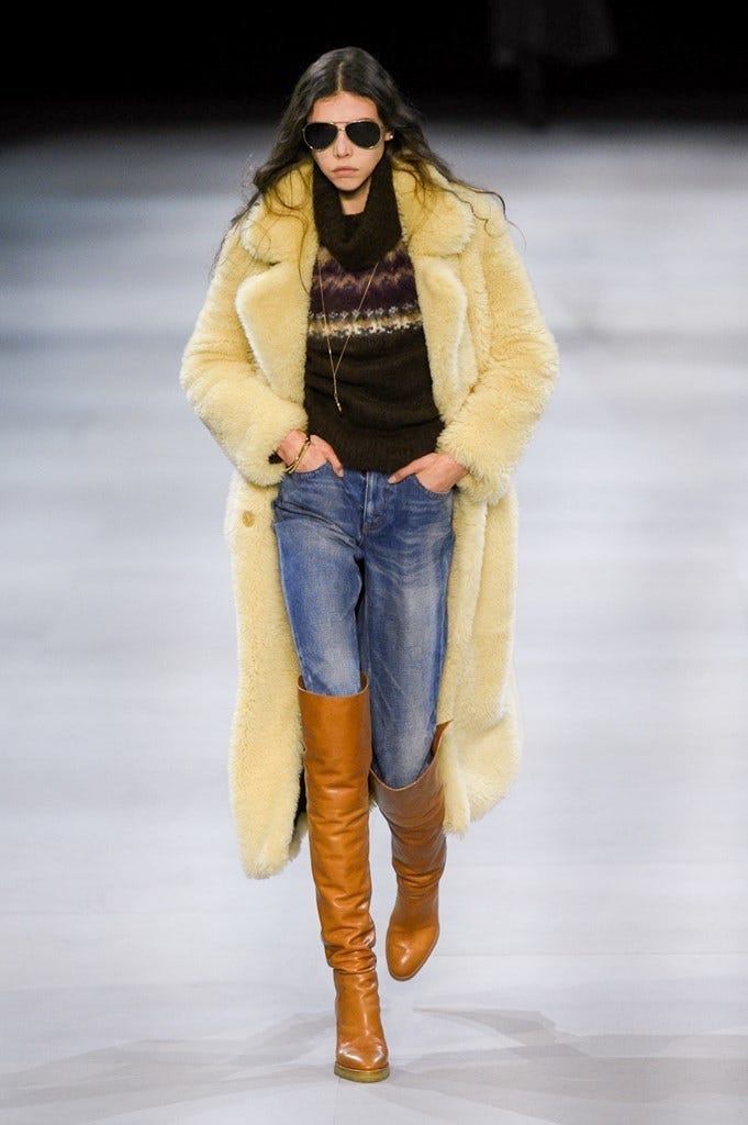 Fashion model, Fashion show, Clothing, Fashion, Jeans, Fur, Fur clothing, Yellow, Footwear, Outerwear, 