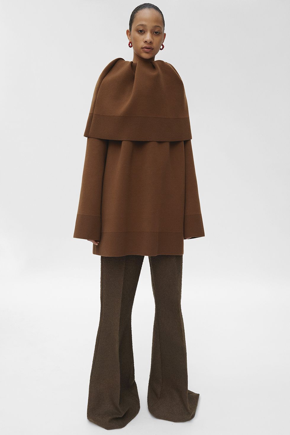 Clothing, Outerwear, Standing, Brown, Coat, Costume, Overcoat, Mantle, Cape, Neck, 