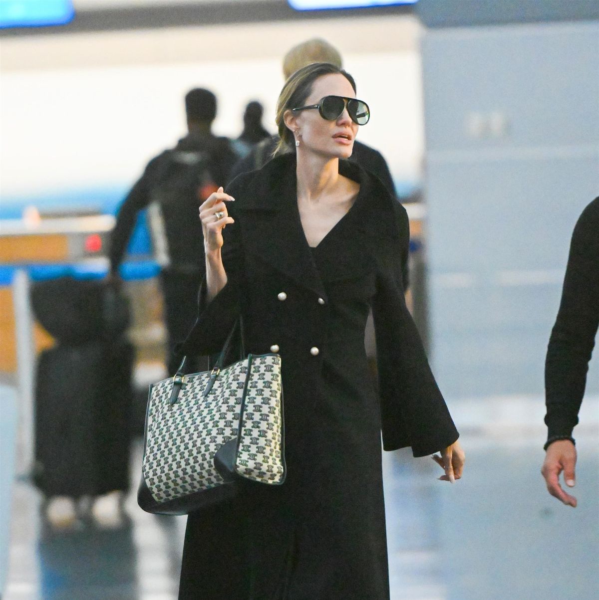 Angelina Jolie Wears the Big Bag Trend While at the D.C. Airport