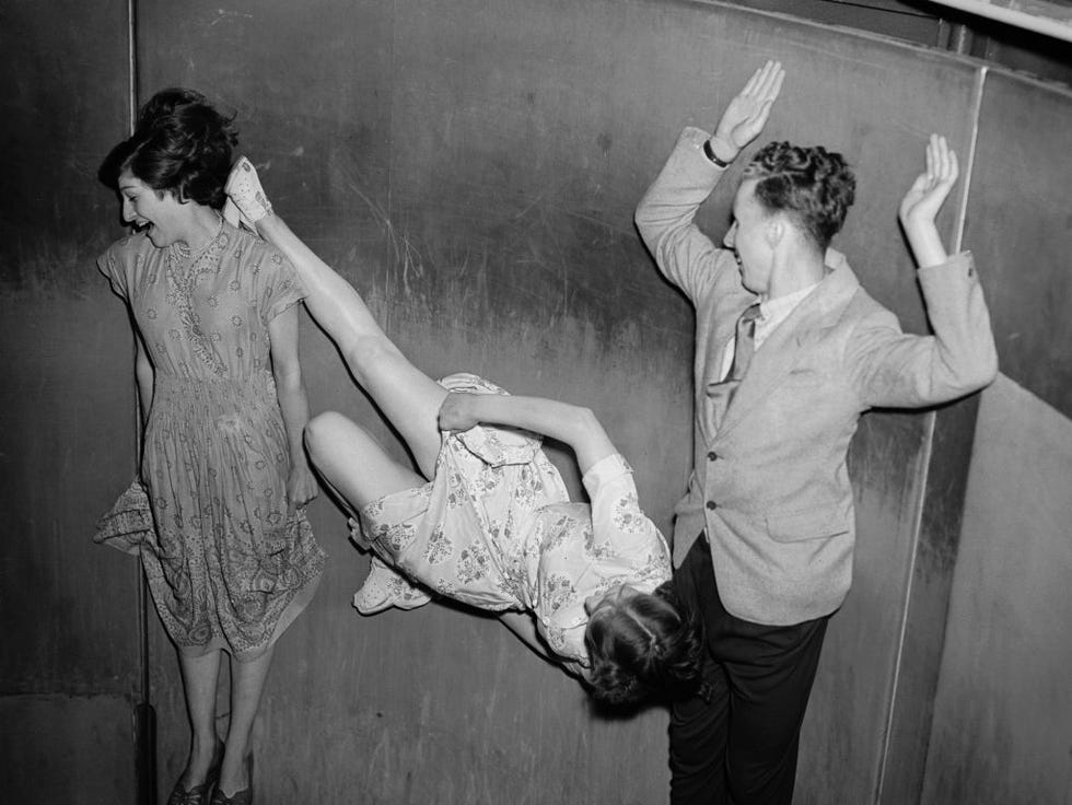 centrifugal force pins three intrepid people to the wall of the rotor at the festival pleasure gardens in london doris flores left appears to be averting her eyes from doris flaxman's immodest display of leg photo by don pricegetty images