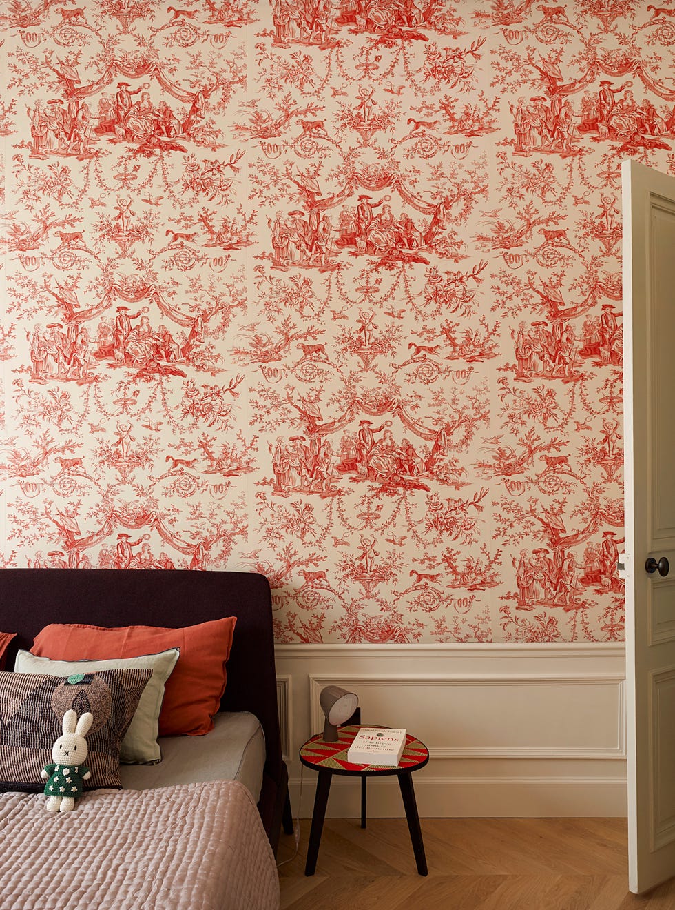 toile du jouy wallpaper in the bedroom of a parisian home