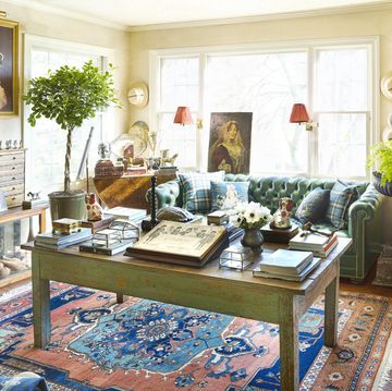 living room paint in buttery yellow in a rich living room filled with antiques