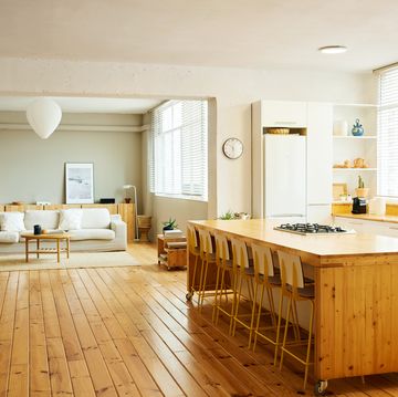 chairs arranged at kitchen island in apartment