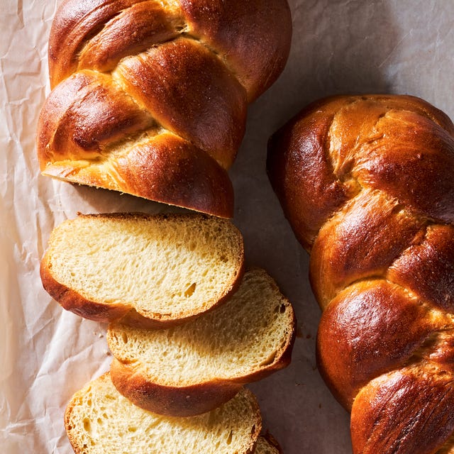 braided challah braid in a loaf and sliced